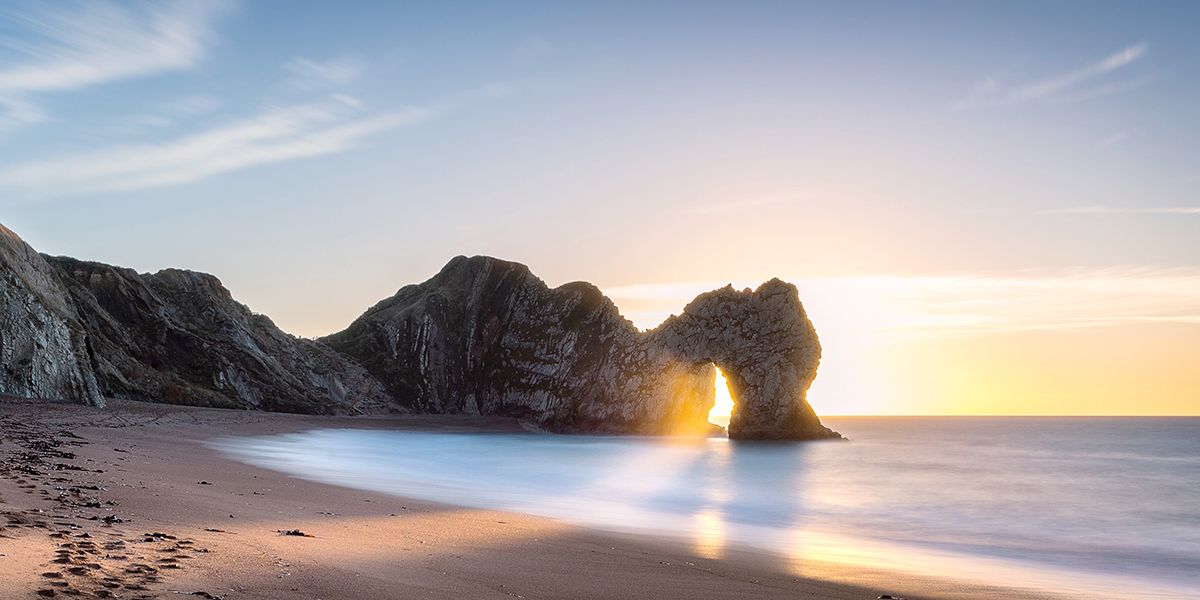 Photo of Durdle Door a rock formation in Dorset. Photo by Andrew Hutchison on Unsplash