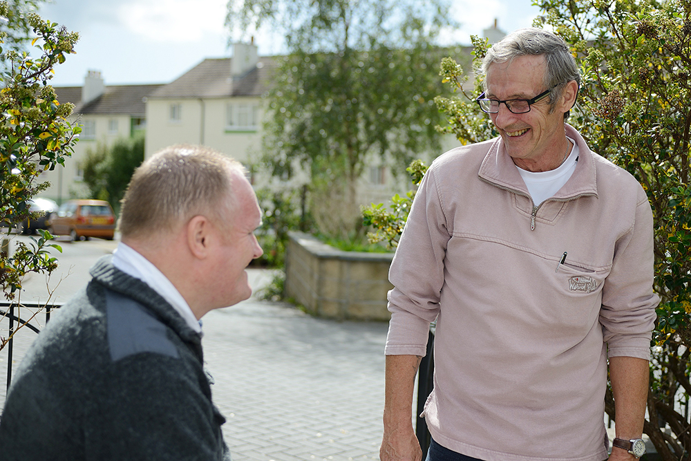 Photo of Chris and Cliff talking.